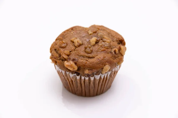 Banana nut muffin shot on a white background