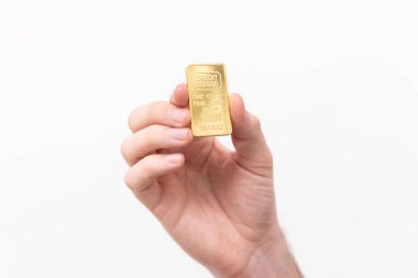 One ounce of solid gold on a white background