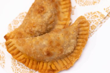 Empanadas from South America shot on a white background