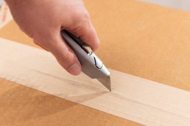 Box cutter that is silver with the blade out