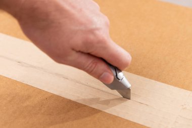 Box cutter that is silver with the blade out