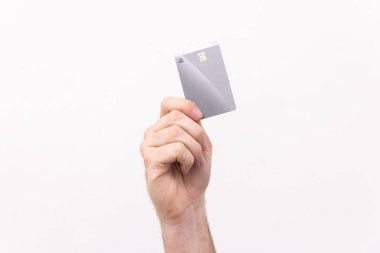 Credit cards being held up against a white background