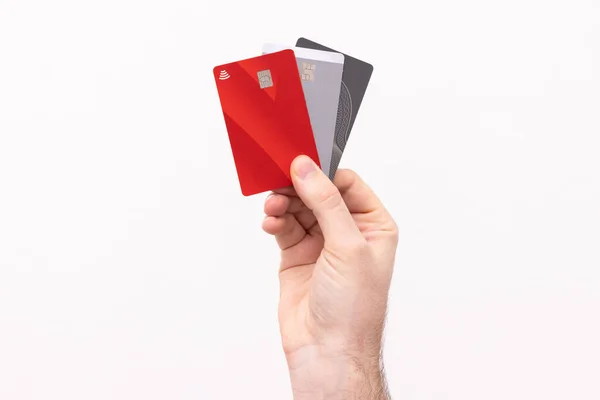 Credit cards being held up against a white background