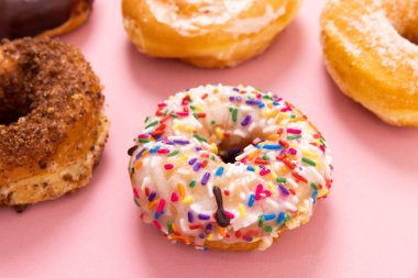 Doughnuts or donuts on a simple background