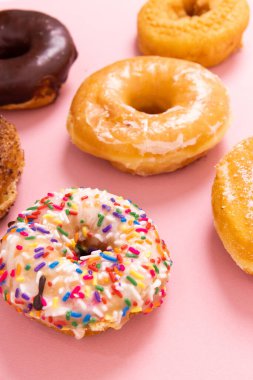 Doughnuts or donuts on a simple background