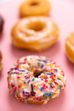 Doughnuts or donuts on a simple background
