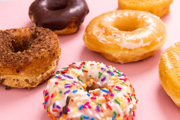 Doughnuts or donuts on a simple background