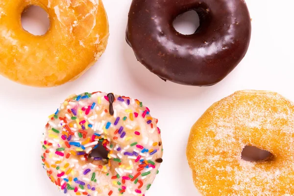 Doughnuts or donuts on a simple background