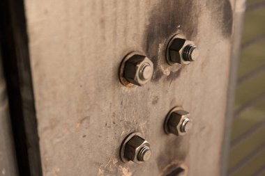 Bolts with washers sticking out of a concrete structure