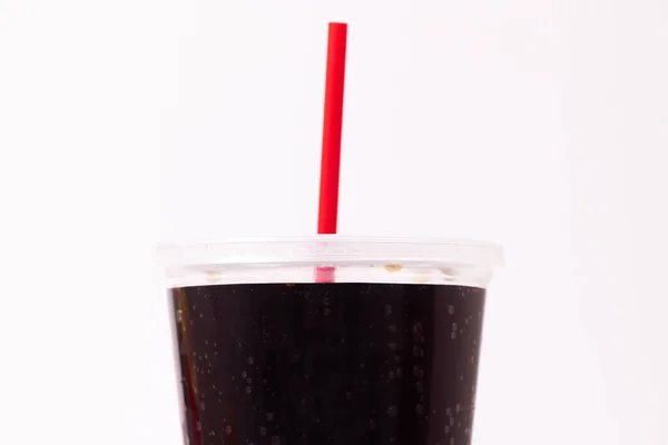 Soda or pop plastic cup with a straw