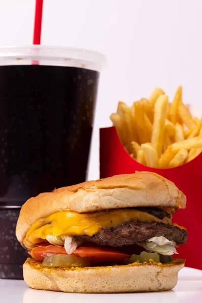 Fast food meal with a burger, drink, and french fries