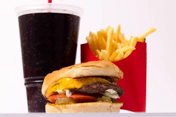 Fast food meal with a burger, drink, and french fries