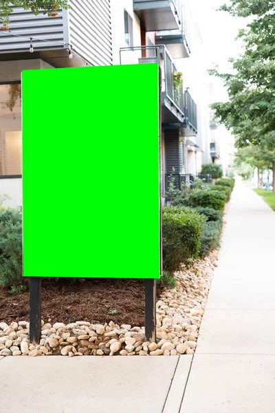Green screen sign outside of a nice property