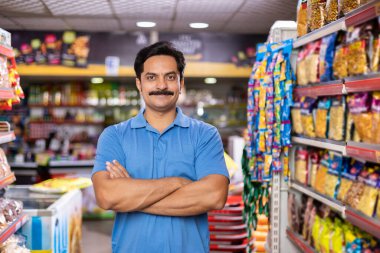 Happy man at supermarket store