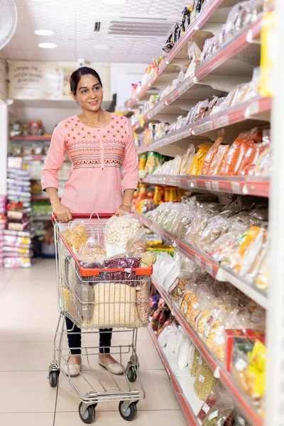 Indian woman shopping at grocery store