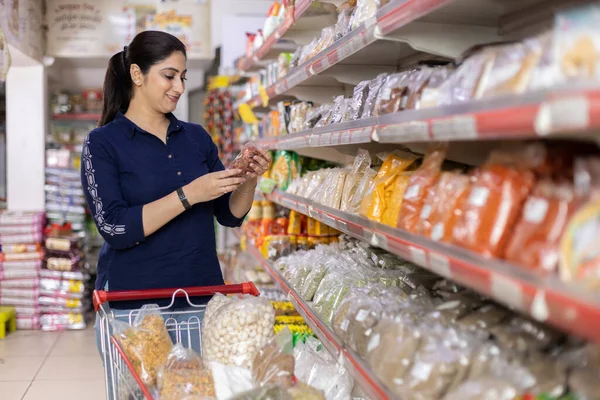 Women Reading Product Information While Shopping Supermarket — Stock Photo, Image