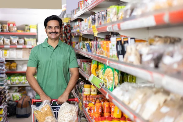 Man at grocery store products