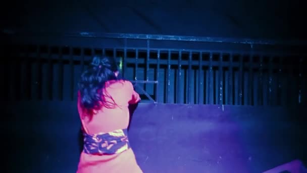 Heartbroken Asian Women Dancing Front Black Fence Purple Lighting Dark — Stock Video