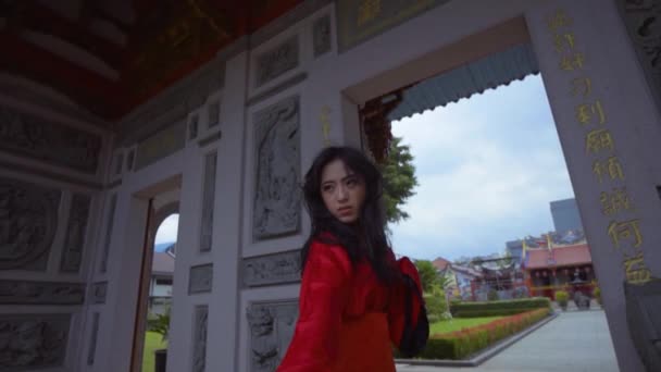 Beautiful Chinese Woman Practices Using Sword Chinese Gate Temple — Video