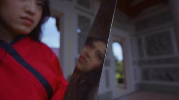 Chinese Woman Holding Silver Sword While Wearing Red Traditional Chinese — Vídeo de Stock