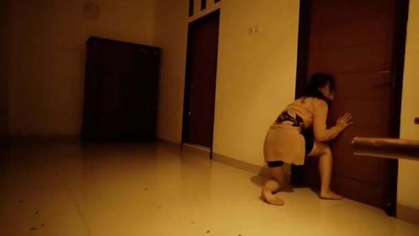 Sad Asian Woman Trying Open Door While Dancing Orange Clothes — Stockvideo