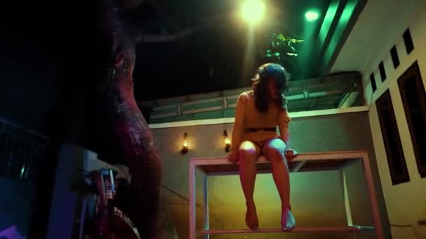 Crazy Asian Women Sitting Table While Dancing Yellow Light Dark — Stock video