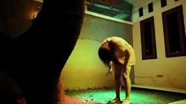 Asian Woman dancing with regret while losing her boyfriend on the relationship