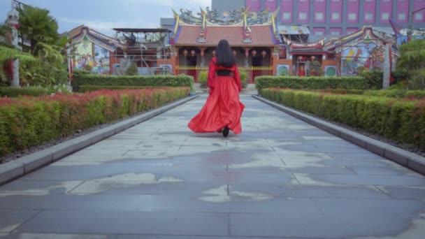 Beautiful Chinese Woman Running Red Costume Garden China Town — Stockvideo