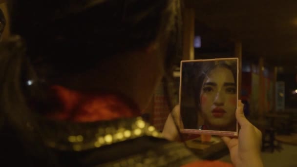 Chinese Woman Holding Mirror While Looking Her Face Clown Makeup — Stock videók