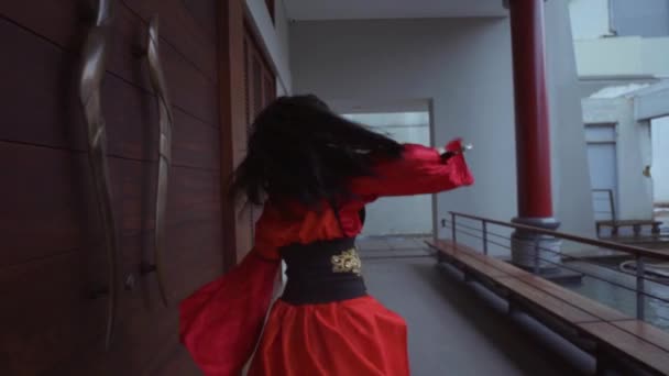 Chinese Woman Waving Silver Sword While Wearing Red Chinese Dress — Vídeos de Stock