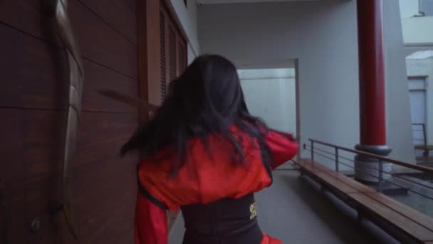 Chinese Woman Waving Silver Sword While Wearing Red Chinese Dress — Vídeo de stock