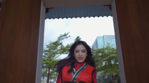 Asian Woman Dancing Full Power While Wearing Chinese Red Dress — Stock video