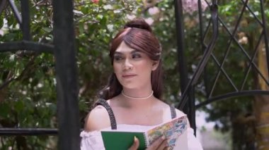 A Royal Princess sitting on the swing while reading a letter inside her garden in the palace