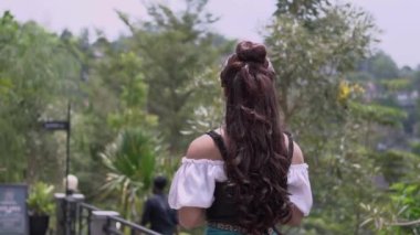 Glamour school girls walking in the jungle while holding the book and wearing a skirt inside the school