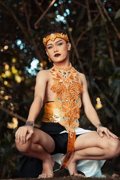 Sexy Asian Man Sitting Big Rock While Wearing Golden Costume — Stock Photo, Image