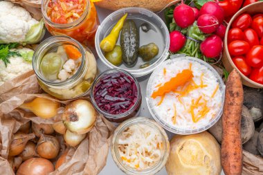 Homemade fermented in glass jars, pickled food from healthy vegetables harvest. Winter fermented and canning superfood concept. Probiotics, enzymes, nutritiion veggy preservation. Selective focus clipart
