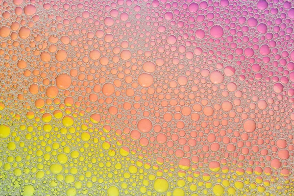 Soap foam. Background of dusty foam with bubbles of blue color for an inscription. Abstract multicolored, white, red, blue background. Colored soap foam texture. Shampoo foam with bubbles.