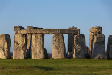 Stones and rocks from Stonehenge, a prehistoric landmark in the English countryside