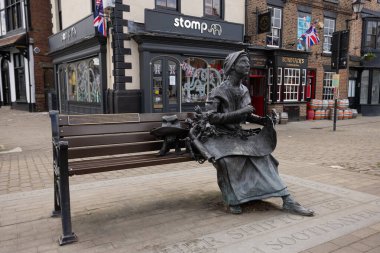 Statue of Ursula Southeil, better known as Mother Shipton, sitting on a bench in Knaresborough Yorkshire, UK