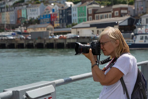 Blonde Woman Photographer Taking Photos Harbour Water Colorful Houses Background — Zdjęcie stockowe
