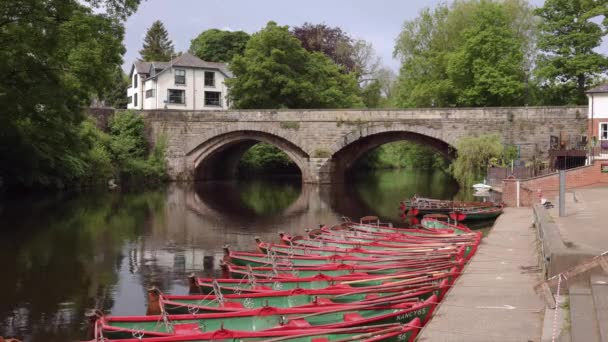 Man Running Bridge Arches River Nidd Red Paddle Boats Moored — Stock video