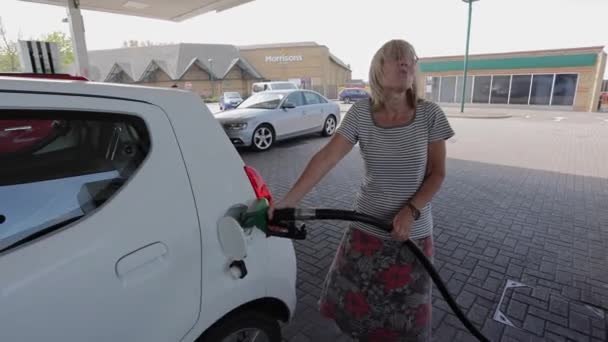 Blonde Woman Fuelling Car Swearing Morrisons Fuel Station — Stock Video