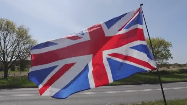 United Kingdom Flag Union Jack Waving Wind Road — Vídeos de Stock