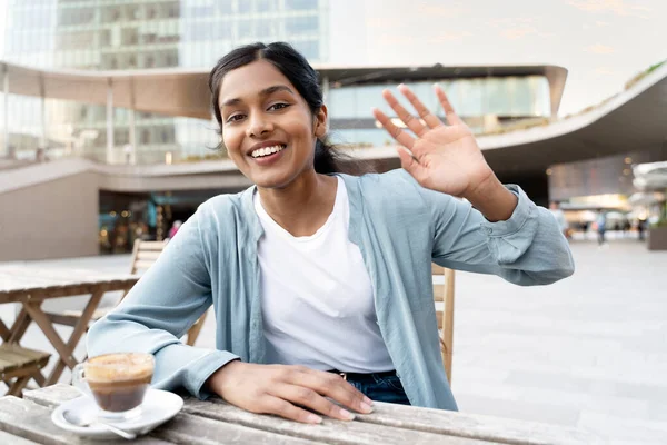 Young Smiling Indian Woman Salutation Having Video Call Sitting Cafe — Stockfoto