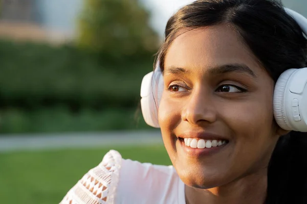 Closeup Portrait Smiling Indian Woman Wearing Wireless Headphones Listening Music — Stok fotoğraf