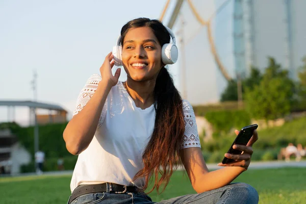 Beautiful Smiling Indian Woman Wearing White Modern Headphones Listening Music — Stockfoto