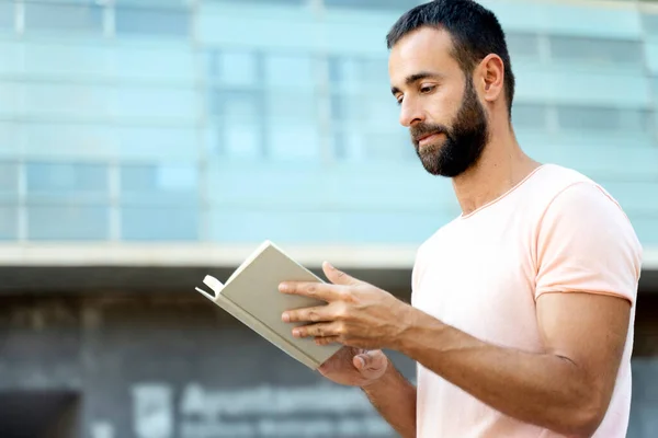 Handsome Pensive Bearded Man Reading Book Standing Street Copy Space — Stockfoto