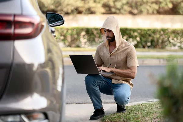 Hacker Trying Steal Car Using Laptop Crime Carjacking Concept — Stockfoto