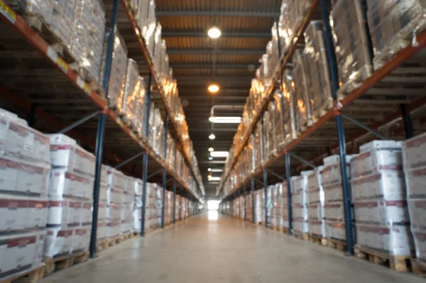 Image of blurred large warehouse. Logistics, inventory warehouse  concept