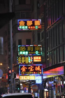 An aesthetic street light in nigh situation which aims to promote their store. This photo was taken ini Nathan Road, Hong Kong.
